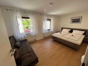 Postel nebo postele na pokoji v ubytování Ferienhaus am blauen Wasser