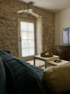 a living room with a couch and a table at Sailor's apartment in Supetar