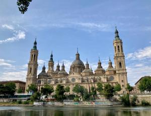 a large building with two towers on top of it at Apartamento centro con parking privado in Zaragoza