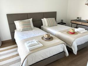 Llit o llits en una habitació de Mar-à-Vista Apartment Nazaré