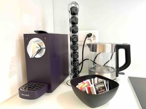 a coffee maker and a blender on a counter at Urban Flat in Lugano