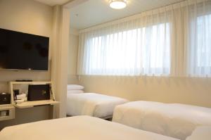Voodi või voodid majutusasutuse Royal Jade Boutique Hotel toas