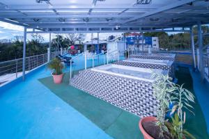 a deck with chairs and a hot tub on a roof at Cozy apartment in Samana with Jacuzzi in Santa Bárbara de Samaná