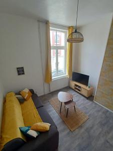 O zonă de relaxare la La Belle Armentières, maison triplex cosy proche de Lille