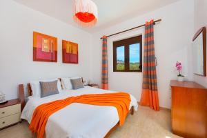 Posteľ alebo postele v izbe v ubytovaní Melfe Villas