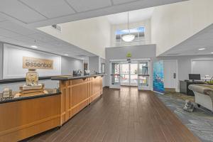 a lobby of a hospital with a waiting area and a reception counter at Sonesta Essential Vacaville Napa Valley in Vacaville