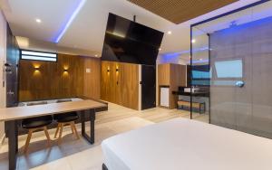 Μια τηλεόραση ή/και κέντρο ψυχαγωγίας στο Drops Motel POA Zona Sul
