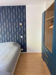 Ένα ή περισσότερα κρεβάτια σε δωμάτιο στο Agréable Villa avec piscine, 12 personnes