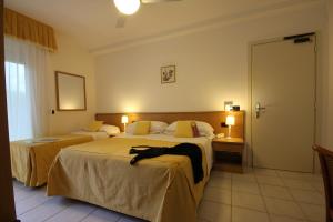 Postel nebo postele na pokoji v ubytování Hotel Miramare + 37 fotografií