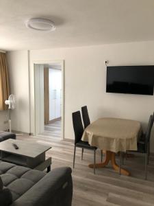 a living room with a couch and a table at Ferienwohnung Erna in Marktoberdorf