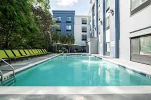 a swimming pool in the middle of a building at SpringHill Suites Gainesville in Gainesville