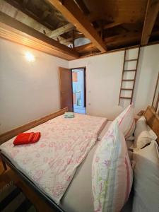a bed sitting in a room with at Apartmani Zora in Kruševo