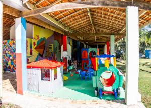 a childrens play area with a playground at Pousada Bem Viver in Ubatuba