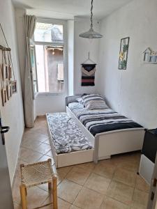 a bedroom with a bed in a room with a window at Appartement Stockholm in Gap