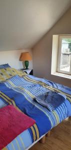 Ένα ή περισσότερα κρεβάτια σε δωμάτιο στο Chez Brigitte