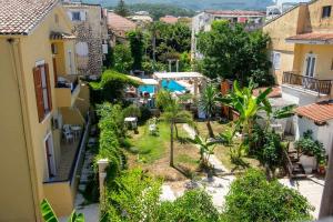 an aerial view of a town with buildings at Fotios Roof apartment in Acharavi