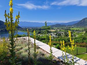 a view from the top of a hill with yellow flowers at Apartment Augenweide in Annenheim