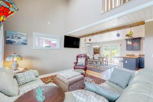 a living room with a couch and a table at Linekin Bay Suite in East Boothbay
