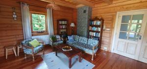 a living room with a couch and chairs and a table at Dom za 7 górami in Kazimierz Dolny