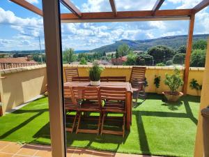 a view from the balcony of a house with a table and chairs at LA CASA DE FUENTETOBA in Fuentetoba
