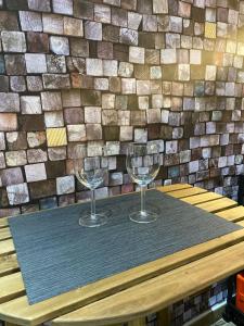 two wine glasses sitting on top of a table at Casa Signoria in Naples