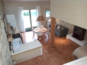 an aerial view of a living room with a table at Au Repos in Tréziers