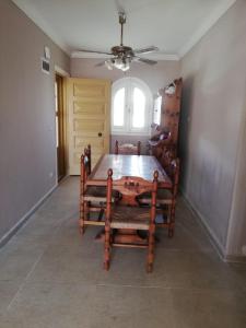 a dining room with a table and a ceiling fan at Northern Coast - Private Resort Holiday Home in Alexandria