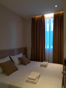 Postel nebo postele na pokoji v ubytování Solea Hotel