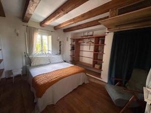 a bedroom with a bed and a window at Il Glicine - Natural BnB in Castello di Godego