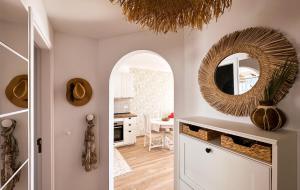 a kitchen and dining room with a mirror on the wall at Diamond Roof in Los Cristianos