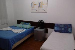 Cama ou camas em um quarto em Pousada Villas