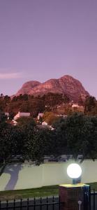 a street light with a mountain in the background at Audrey's Self-Catering Accommodation in Cape Town
