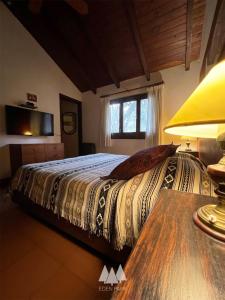 En eller flere senge i et værelse på Eden Park Cordoba