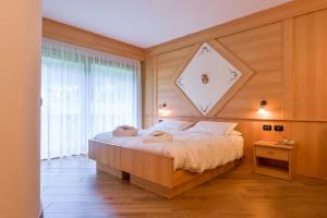 Chalet Pineta relax location客房内的一张或多张床位
