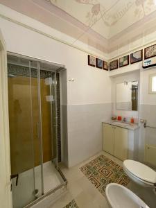 a bathroom with a shower and two toilets at Stanze al Genio B&B in Palermo