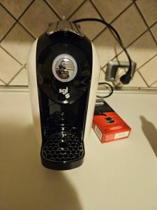 a black and white blender sitting on top of a counter at La Piccola Valle in Vallefiorita