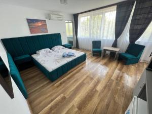 Postel nebo postele na pokoji v ubytování Cool Breeze - Mamaia Nord