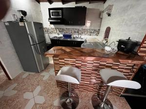 Kuchyň nebo kuchyňský kout v ubytování Aparta Suite Torre De Prado 503