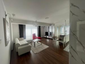 a living room with a couch and a table at Skopje Kale Luxury Apartment in Skopje