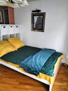 a bedroom with a large bed with at Park Studio in Oborniki Śląskie