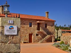 a building with a sign on the side of it at Casa Ceferinos in Muxia