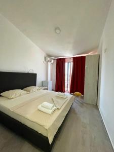 Cama ou camas em um quarto em Apartmani Vila Milaris