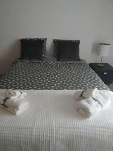 Postel nebo postele na pokoji v ubytování Apartamento em Fuseta - Casa da Praia