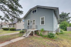 a blue house with a staircase in front of it at Cozy Westmont Home Walk to Metra Station! in Westmont