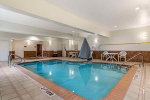a large swimming pool in a hotel room at Comfort Suites Medical Center Near Six Flags in San Antonio