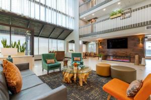 a lobby with a couch and chairs and a table at Best Western Corpus Christi Airport Hotel in Corpus Christi