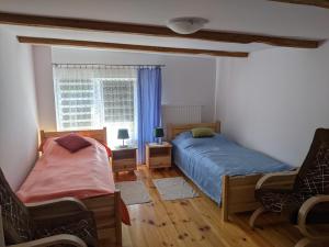 Tempat tidur dalam kamar di Pałaszówka