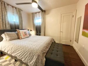 a small bedroom with a bed and a window at The Wesley Walla Walla in Walla Walla