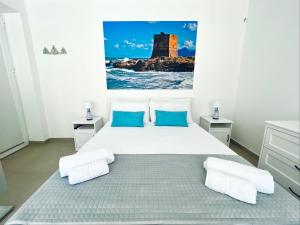 Postel nebo postele na pokoji v ubytování Torre Pozzillo Beach