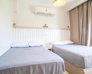 Postel nebo postele na pokoji v ubytování Marassi Northcoast